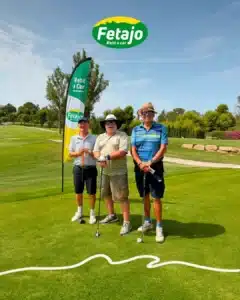 Three golfers with a Fetajo Rent a Car banner on the tee at Atalaya Golf during the WAGC Andalucía qualifying round
